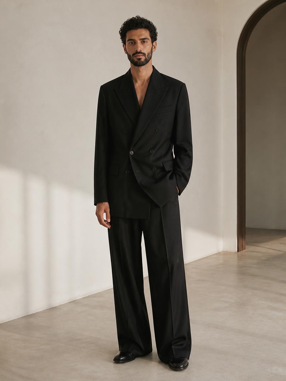 Front full-body view of the UNSTRCT 02 double breasted suit in black