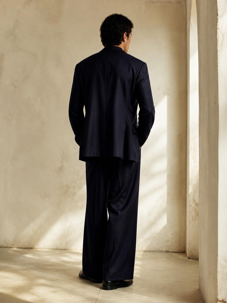 Back view of the UNSTRCT suit in navy